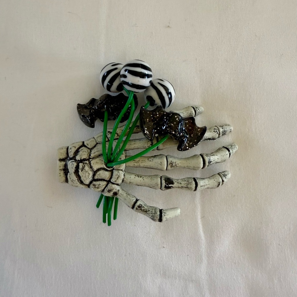 Skeleton hand brooch
